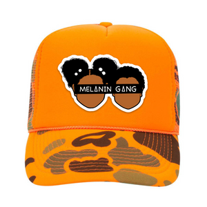 Orange and cameo trucker hat with Melanin Gang Logo on the front. 